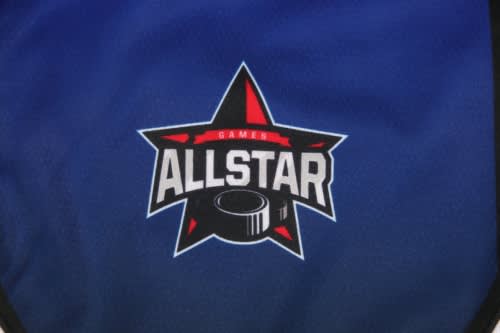 A blue sports uniform kit featuring a logo with a star and a hockey puck design.