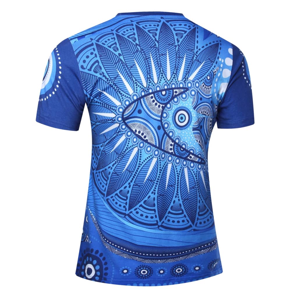 A blue t-shirt featuring intricate Aboriginal patterns and designs on the back, with a logo present.
