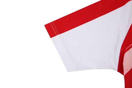 A rugby uniform with red and white fabric, featuring a short sleeve design and a logo on the front.