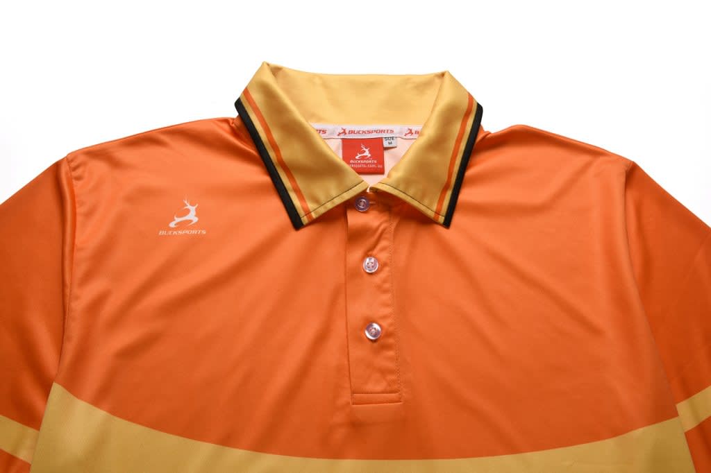 A customised polo shirt in orange and yellow with a logo on the chest and a striped collar.