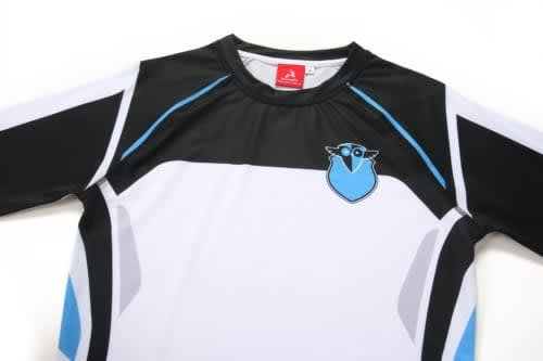 A sports uniform featuring a black, white, and light blue design, with a logo on the chest area.