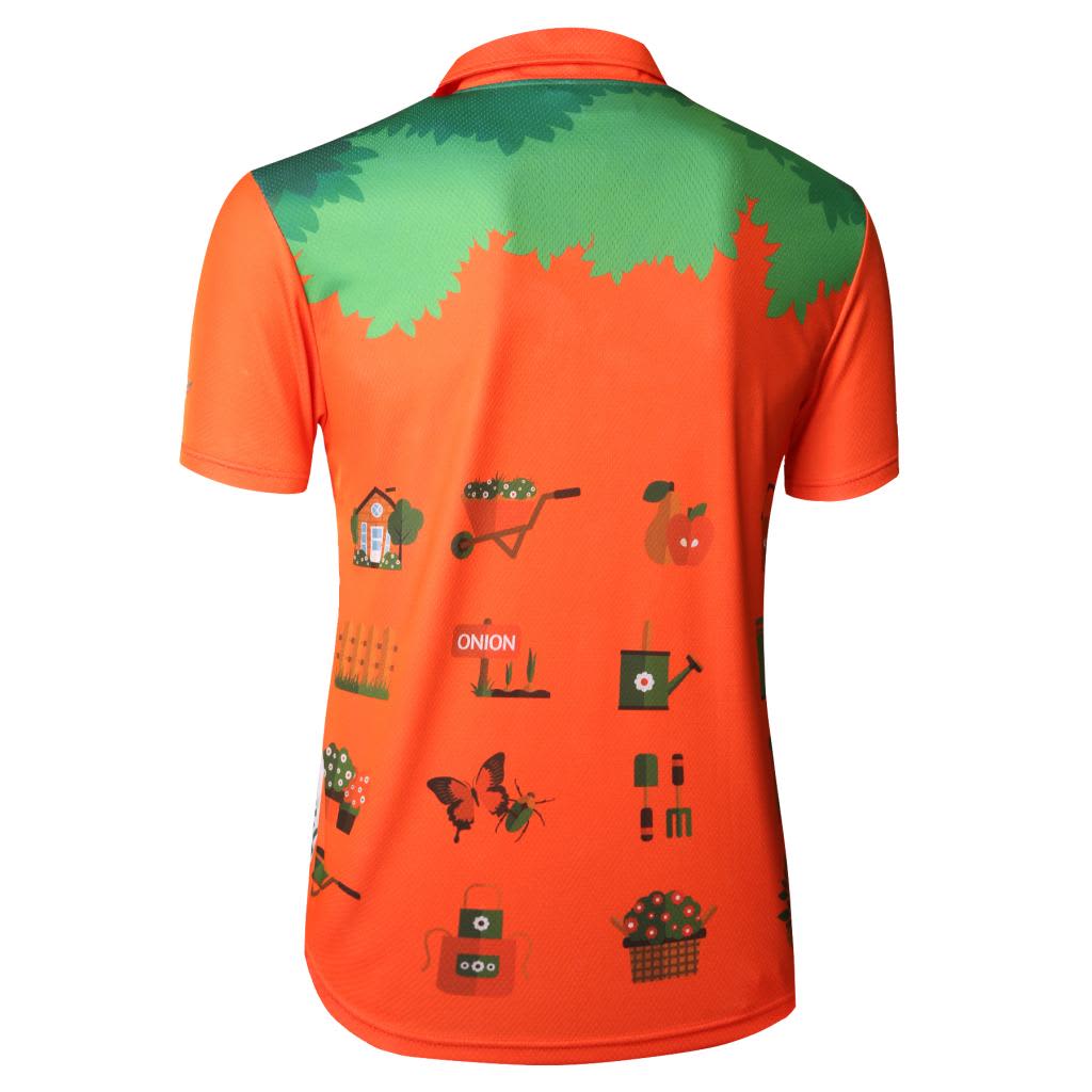 An orange polo shirt featuring a vibrant green leafy design with gardening-themed graphics. It has a logo on the side.