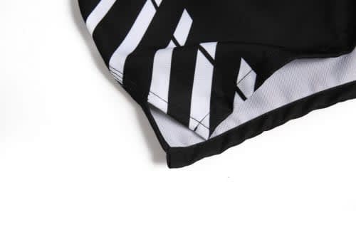 A black sports jersey featuring diagonal white stripes and a logo on the side.