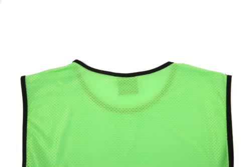 A green mesh bib with a black trim, featuring an opening for the head at the top.