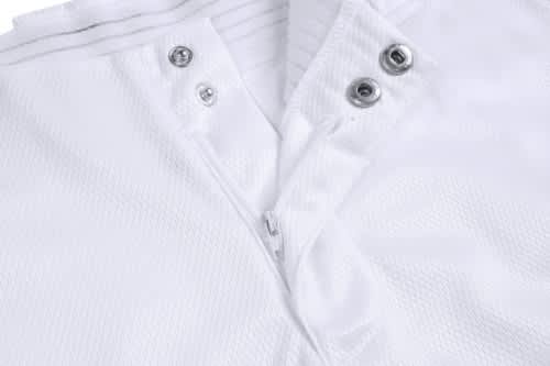 A white sports jersey featuring a zippered front and snap buttons, showcasing a textured fabric and an attached logo.