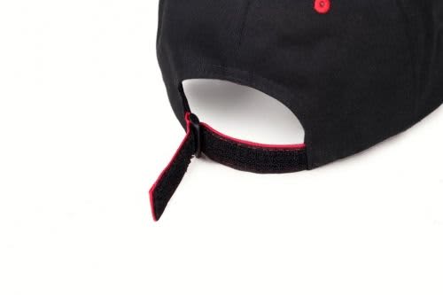 A black cap with red accents and an adjustable strap at the back. It features a logo.