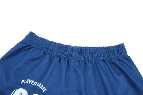 A blue sports jersey featuring an elastic waistband and a logo, with space designated for a player name.