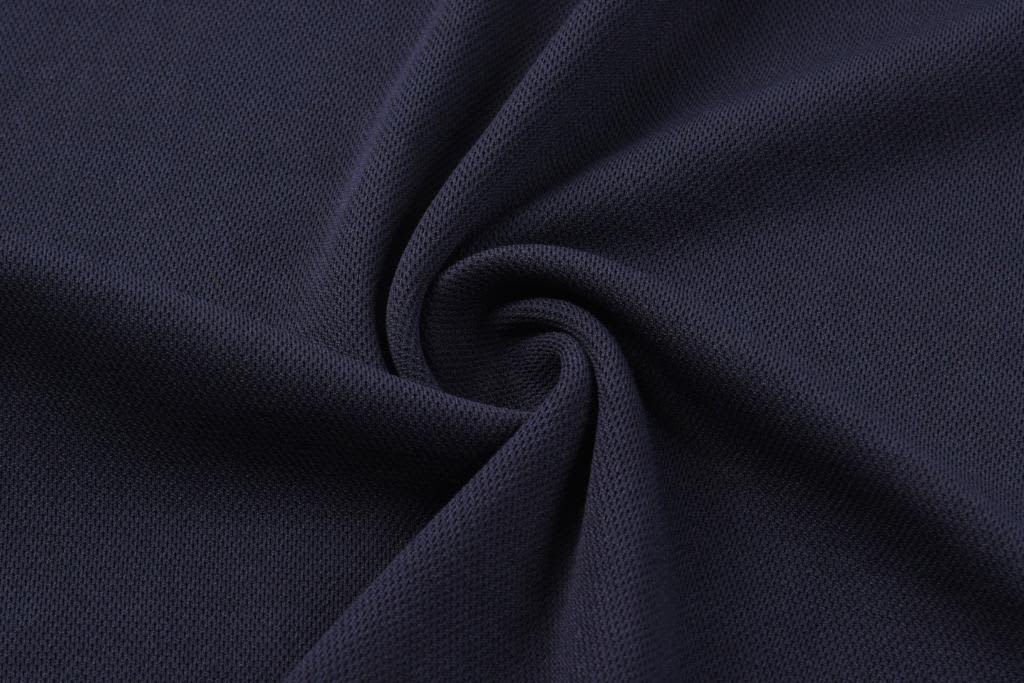 A dark navy fabric with a textured surface, featuring a subtle pattern and smooth finish.