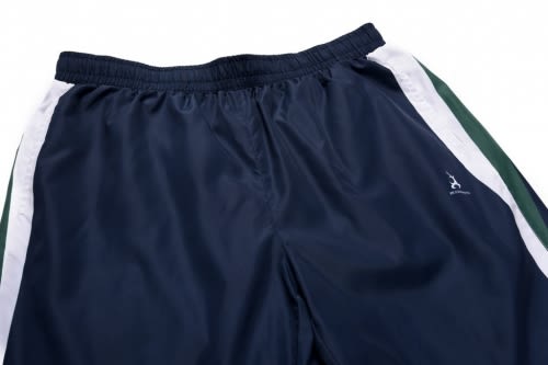 A navy blue sports uniform featuring white and green side panels, with an emblem on one leg.