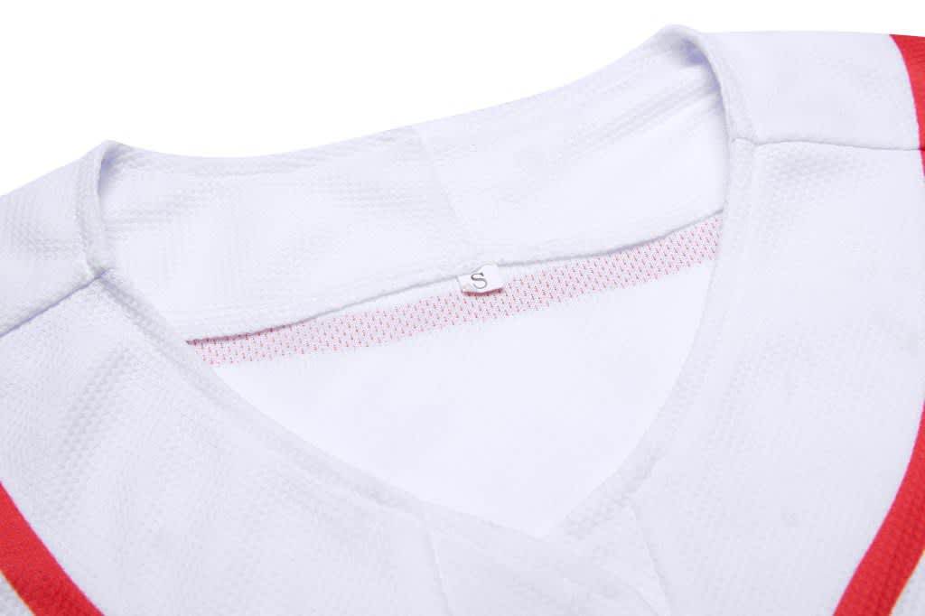 A sleeveless baseball singlet in white with red accents, featuring a V-neck design and a size label inside.