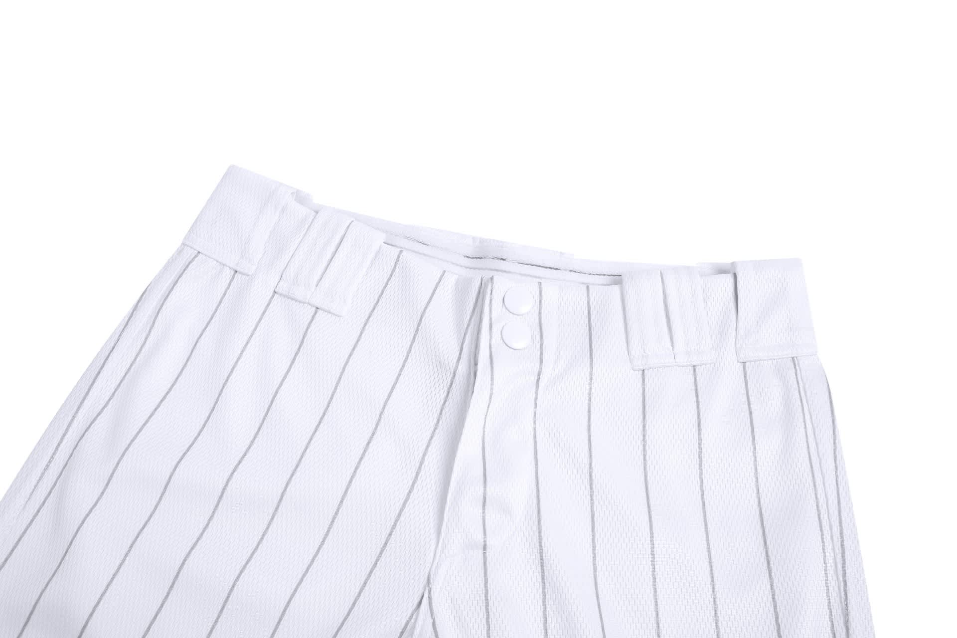 White baseball/softball cropped pants with pinstripe design and button closure at the waist, featuring a logo.
