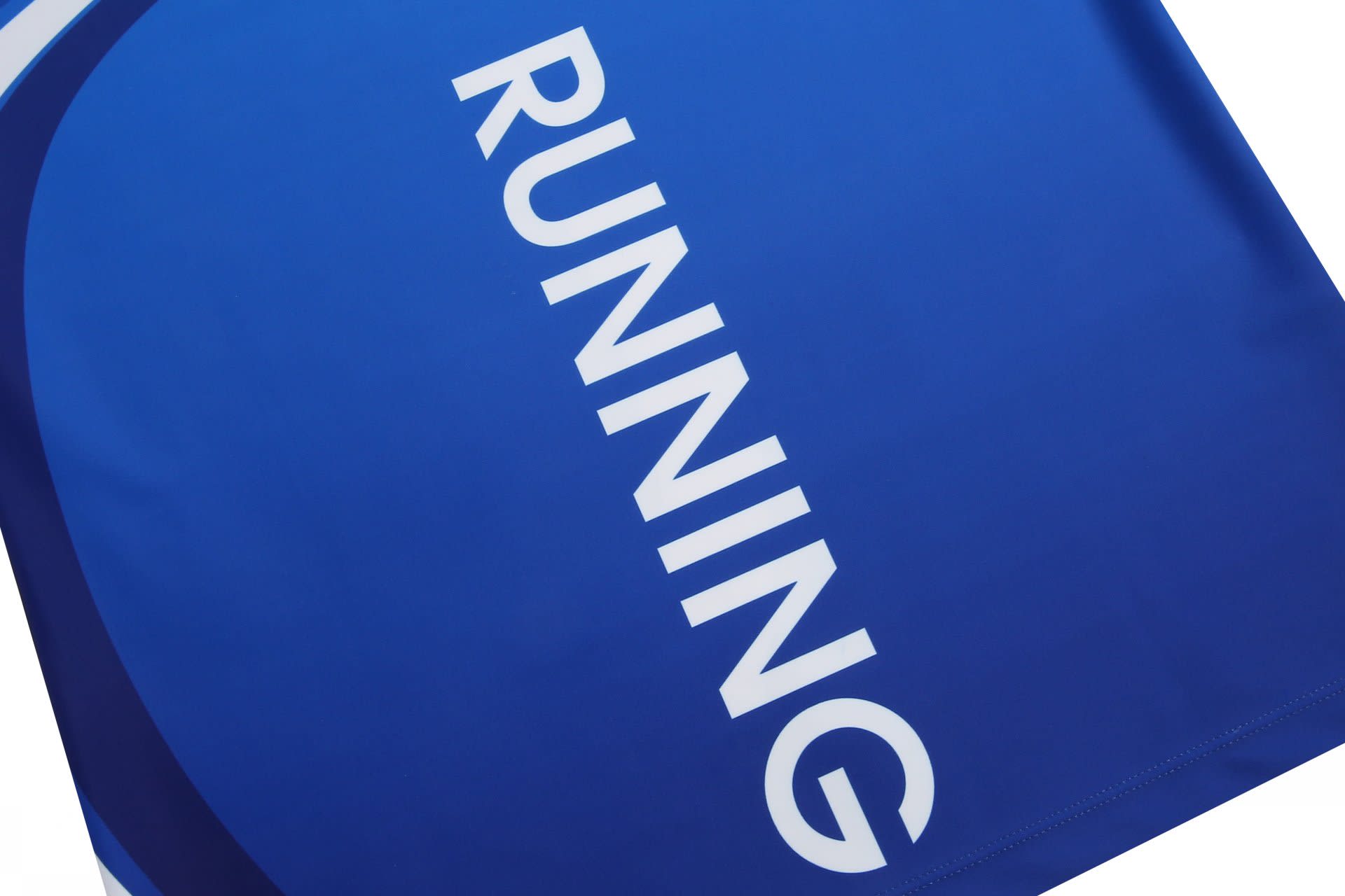A blue athletics uniform tight featuring the word "RUNNING" prominently displayed. The item also has a logo.