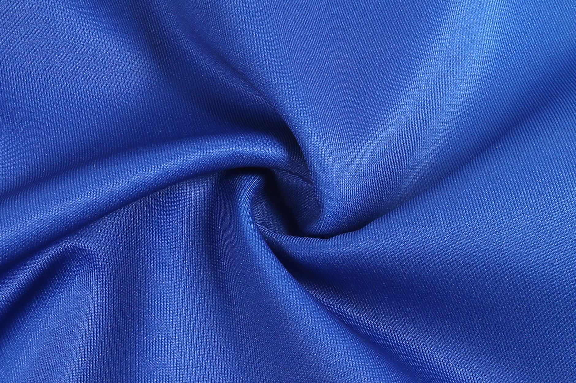A fabric swatch in vibrant royal blue, showcasing a smooth and glossy texture. It features folds and draping.