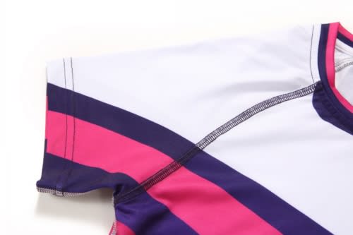A sports jumper featuring a white base with pink and purple striped accents, along with a logo on the design.