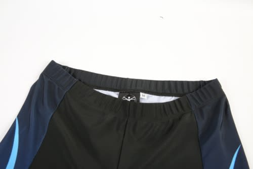 A cycling team jersey in black with blue accents, featuring an elastic waistband and a logo.