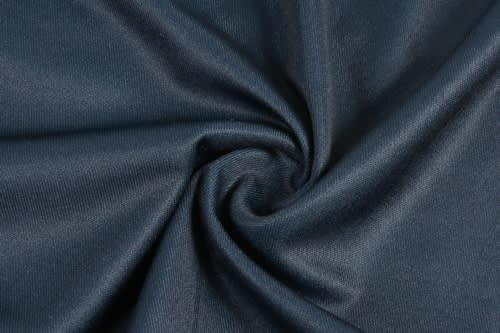 A close-up of dark blue fabric, twisted to showcase its texture and weave. The material appears smooth and athletic.