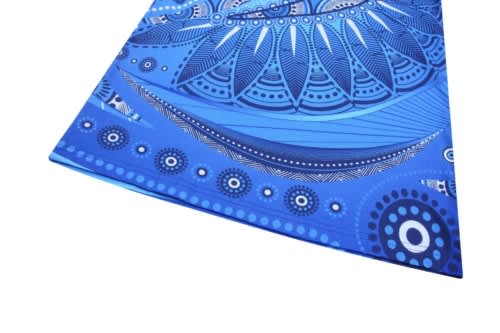 A blue t-shirt featuring intricate, abstract design elements in varying shades of blue. The shirt includes a logo.