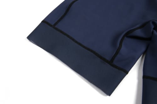A close-up of a navy blue rowing uniform suit featuring black seams and textured fabric details.