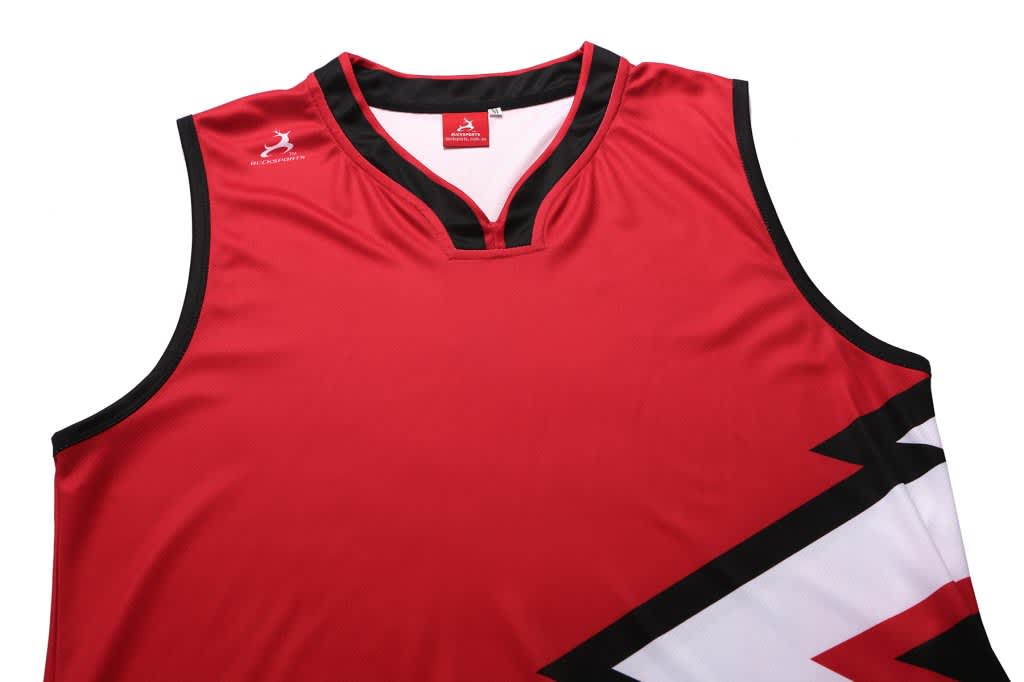 A red singlet with black and white design elements, featuring a logo on the upper left side.
