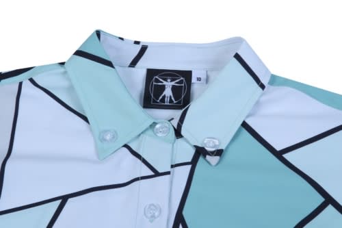 A custom shirt featuring a geometric pattern in light blue and black, with a pointed collar and buttoned front.