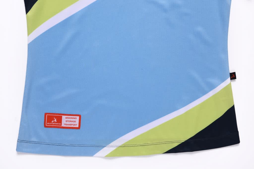 A blue and green polo shirt with a geometric pattern and a label featuring a small logo.