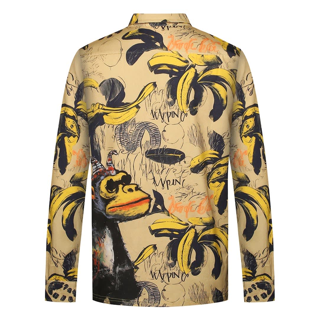 A sports jumper with a vibrant banana and monkey print design, featuring long sleeves and a collar.