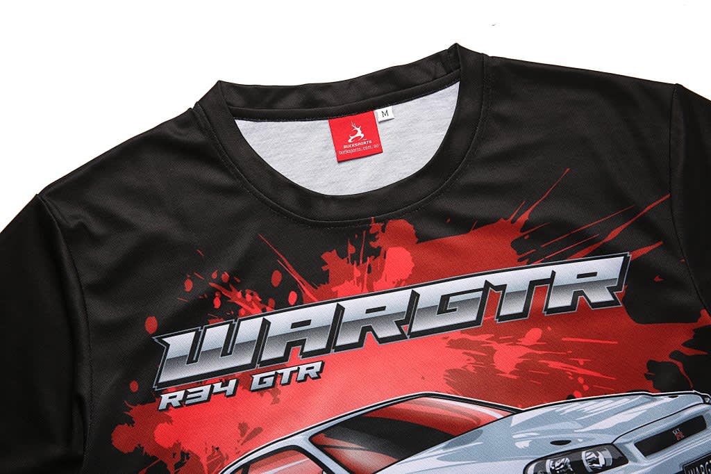 A black racing T-shirt featuring a graphic design with red and grey accents. It has a logo tag on the collar.