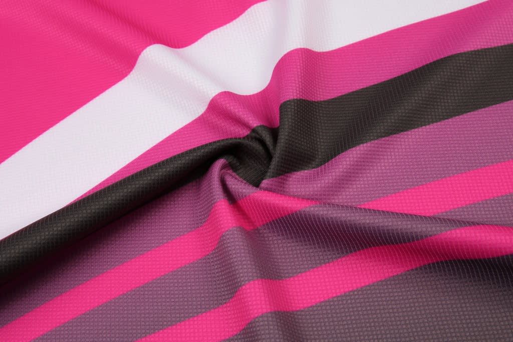 A fabric featuring bold stripes in pink, white, and dark brown colours, showcasing a smooth texture.