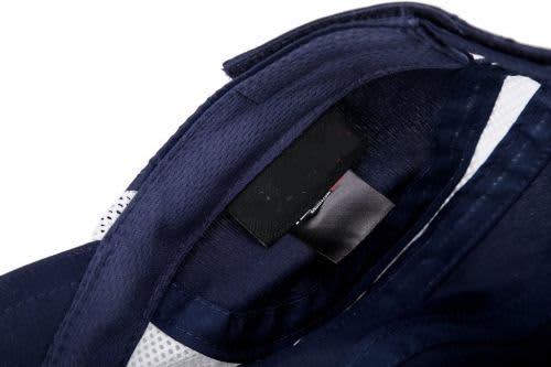 A navy sport mesh running cap with a branded label inside, featuring a breathable lining.