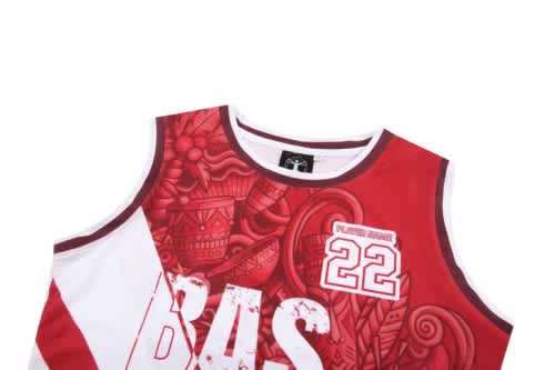 A red and white basketball uniform featuring intricate designs and a logo, with the number 22 displayed prominently.