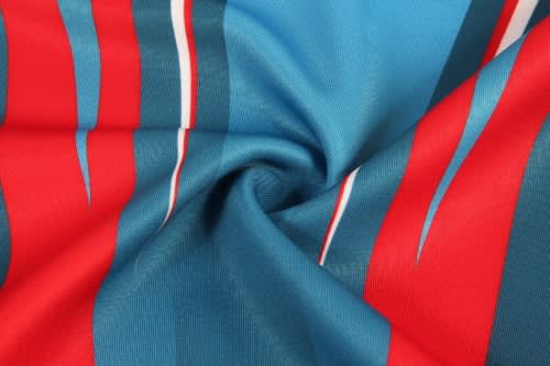 A fabric featuring bold blue, red, and white stripes, designed for rugby team wear. The fabric has a smooth texture.