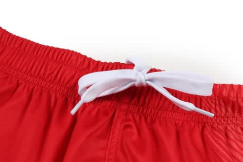 A red volleyball uniform featuring an adjustable white drawstring at the waistband.