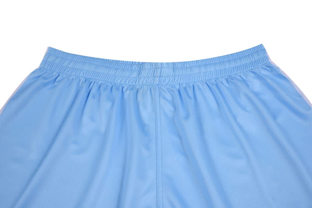 Light blue shorts with an elastic waistband, featuring gathered stitching at the waist. The garment has a simple design.