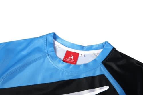 A sports uniform featuring a predominantly blue top with black accents and a logo on the collar.
