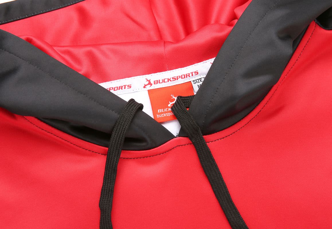 A red hoodie with a black hood and drawstrings, featuring a tag with branding inside the collar.