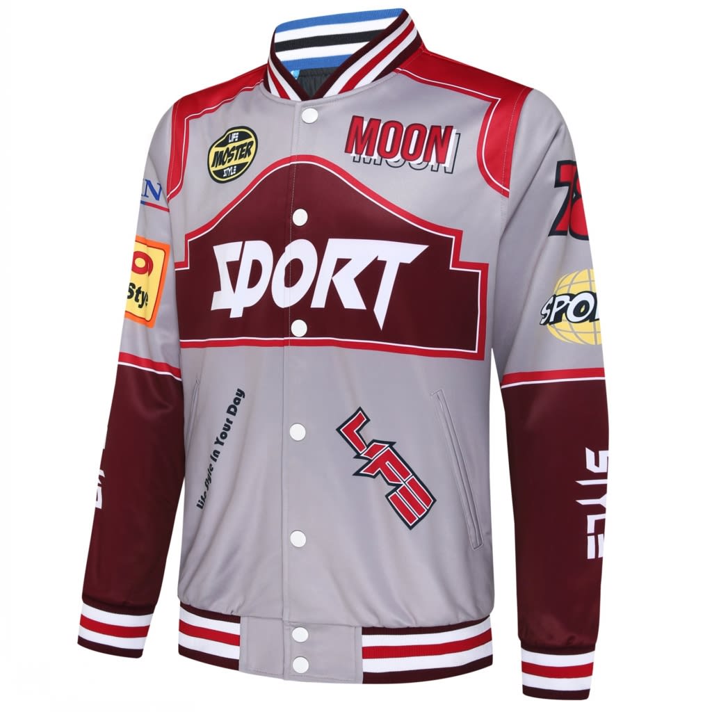A reversible varsity jacket in grey and burgundy, featuring various patches and a striped collar.