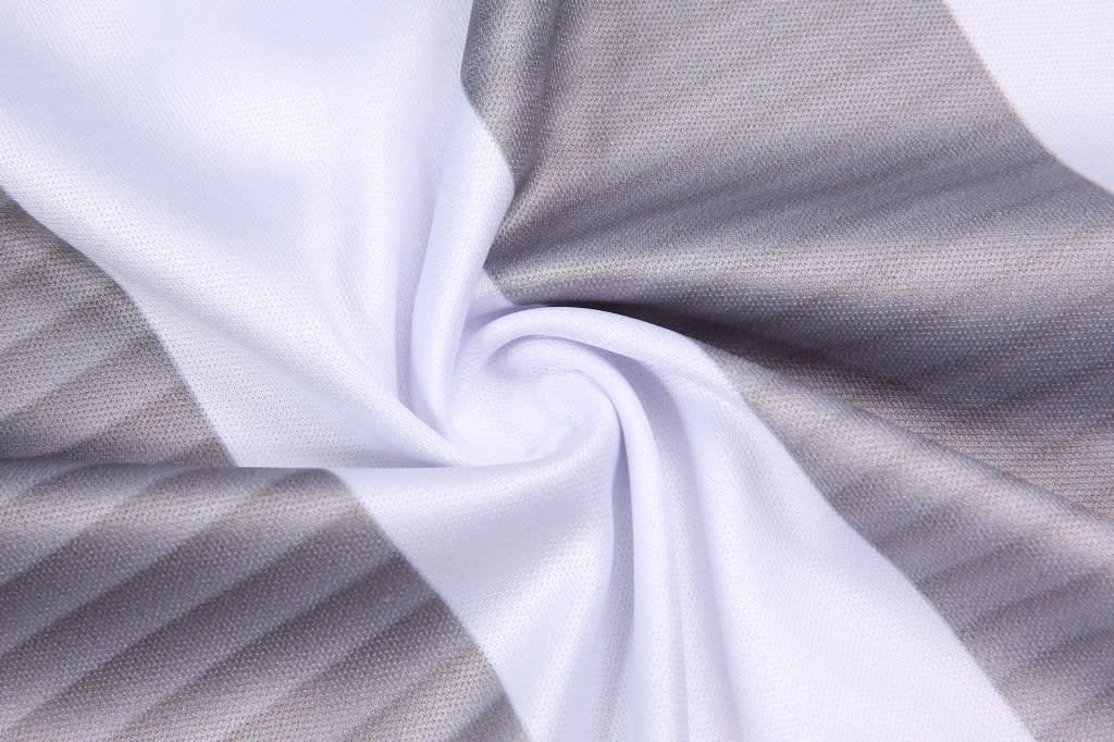A patterned fabric featuring horizontal grey and white stripes, showcasing a smooth texture.