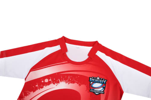 A red rugby jersey with white sleeves, featuring a logo on the front and a dynamic design.