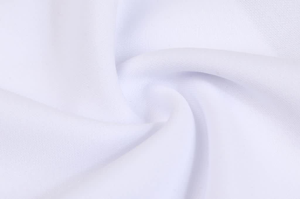 A white fabric with a smooth, twisted texture, suitable for apparel. It has a soft appearance.