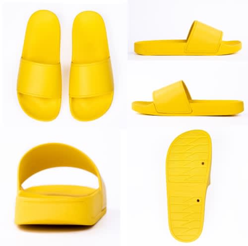 Yellow slippers displaying a sleek design, featuring two wide straps, a back heel, and a textured sole.
