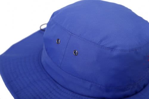 A wide brim hat in bright blue, featuring ventilation eyelets and a textured brim. The hat has a logo.