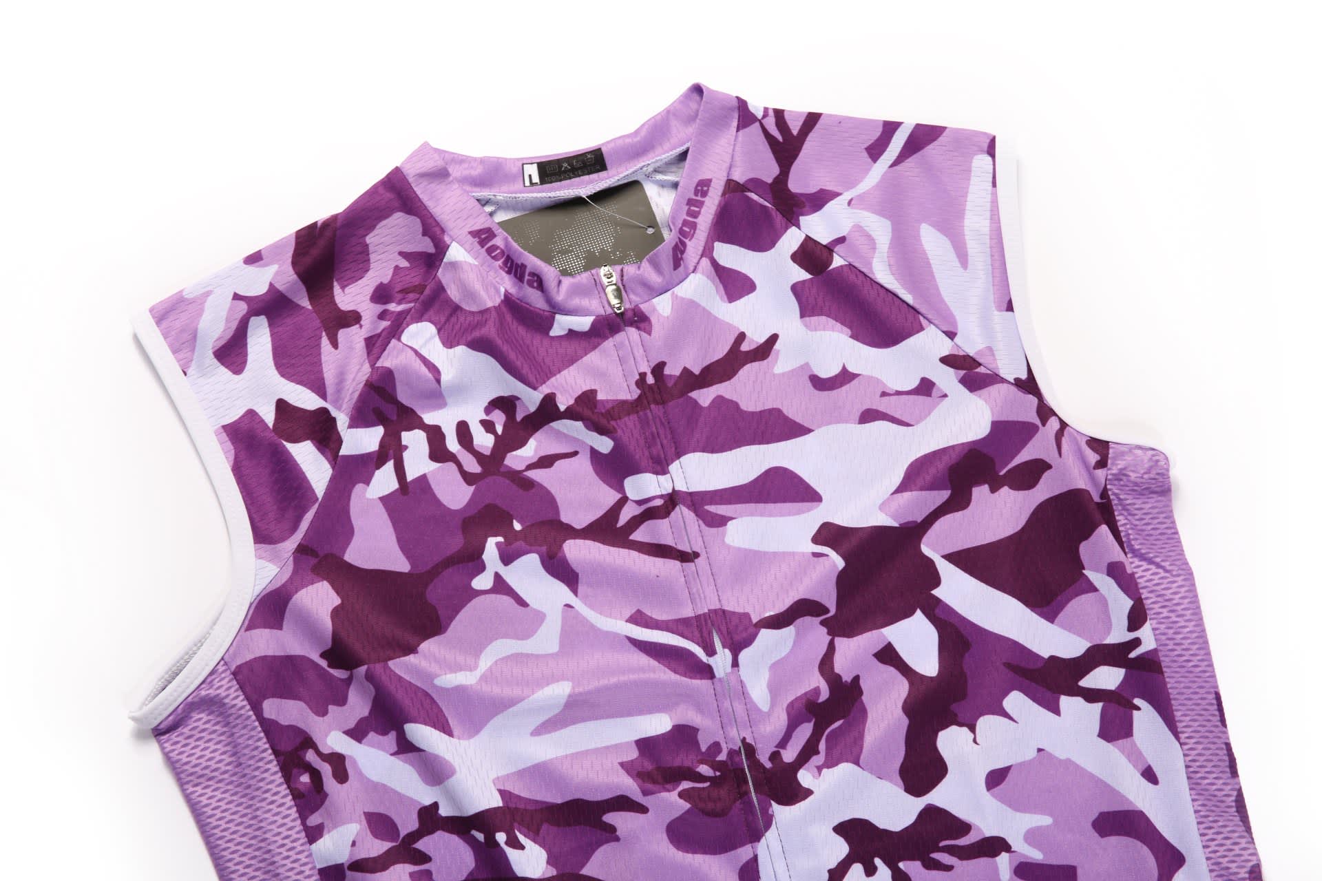 A cycling racing vest in shades of purple with a camouflage pattern and a partial zip at the front.
