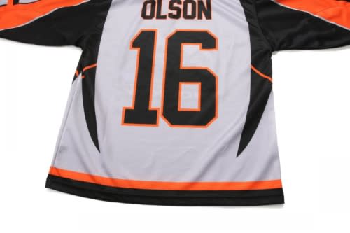A grey ice hockey jersey featuring orange and black accents, with the name "OLSON" and the number 16 displayed.