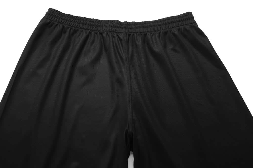 Black basketball shorts with an elastic waistband, featuring a simple design and no visible branding.