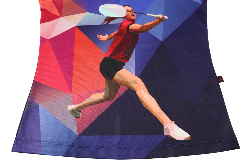 A badminton club uniform in vibrant red and blue, featuring a geometric design and an illustration of a player in action.