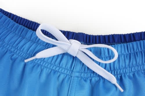 Blue sports shorts featuring a drawstring tie at the waist, with elasticated detailing.