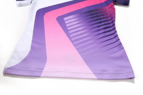 A sports jumper featuring a pink and purple design with abstract lines and a logo.
