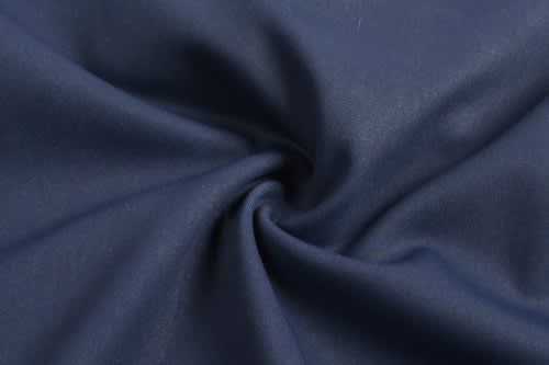 A navy blue fabric with a smooth texture, showcasing a swirl pattern. Suitable for sports uniforms.