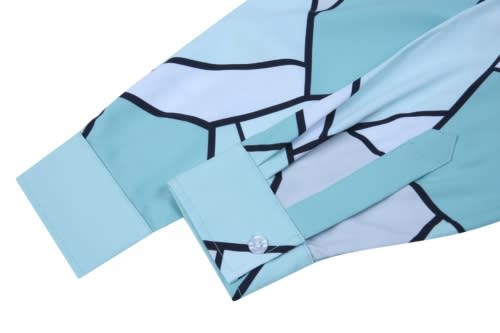 A custom shirt featuring a geometric pattern in shades of mint green and black, with a buttoned cuff.