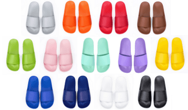 A collection of slippers in various colours, including grey, orange, red, brown, green, pink, mint, purple, navy, white, and black.